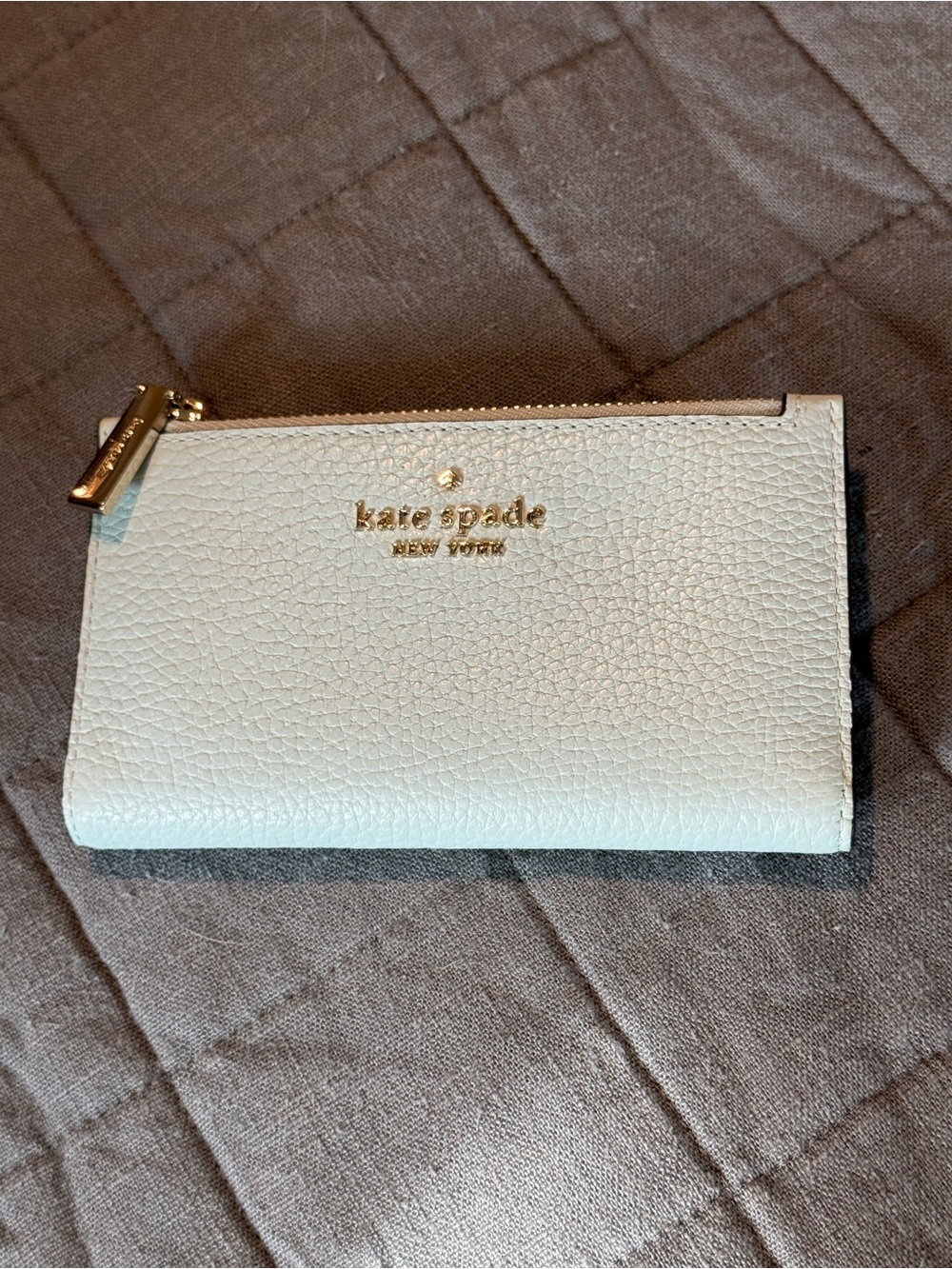 kate spade light blue leather continental wallet with gold logo